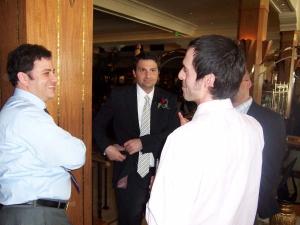 Jimmy Kimmel (far left), clearly delighted to be meeting the author (whose back is to the camera), at a wedding.